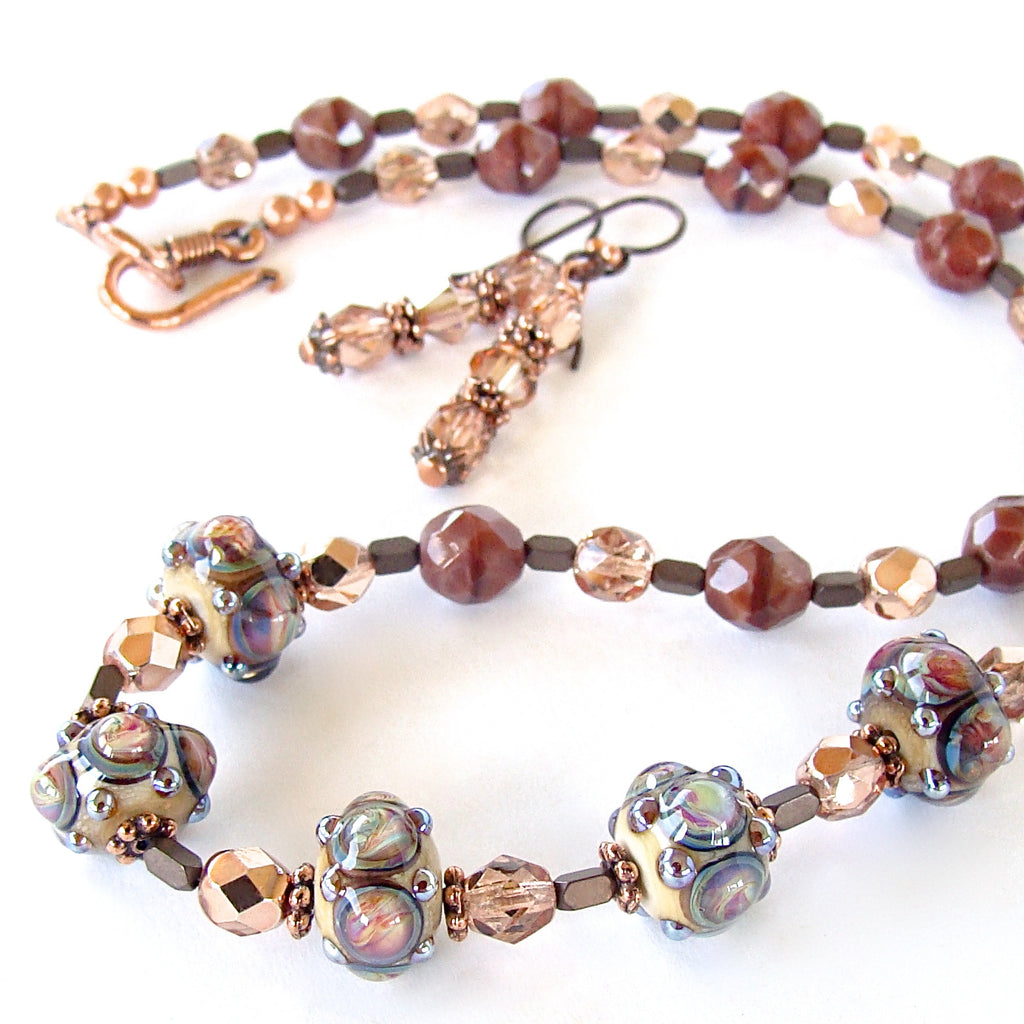 Handmade glass jewelry in rose tones