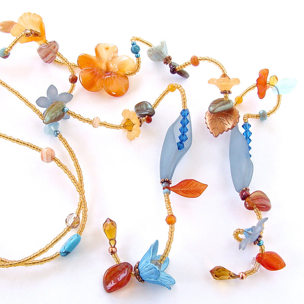 Long beaded flower necklace in blue and orange