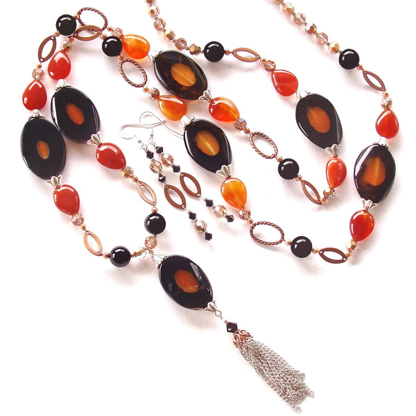 long pendant necklace in orange and black